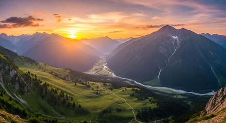 Panoramic view of a valley at sunset amongst high mountains.