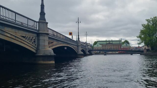 Shot of Vasabron bridge connecting Norrmalm and Gamla Stan in the center of Stockholm, Sweden on an overcast spring day