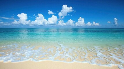 Fototapeta premium A serene beach scene with crystal clear turquoise water and white sand, under a bright blue sky with scattered white clouds.