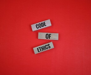 Code of Ethics Blocks on a red Background for Professional Concepts