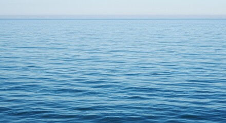 Tranquil Blue Ocean Water Surface Texture Meeting the Horizon and Hazy Sky