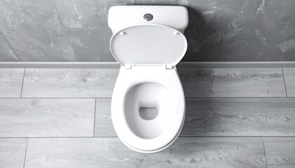Empty white toilet bowl on tiled floor