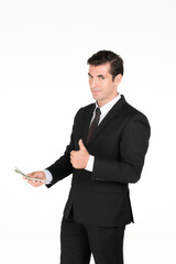 Half-body headshot confident businessman in a black suit holds cash and gives a thumbs-up, symbolizing financial success, good returns, and satisfaction studio on white background.