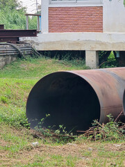 old rusty steel pipe in garden