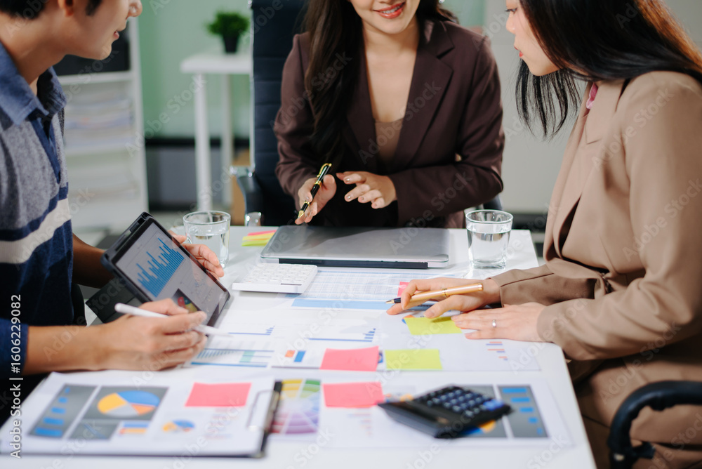 Poster business documents on office table with smart phone and calculator digital tablet and graph business