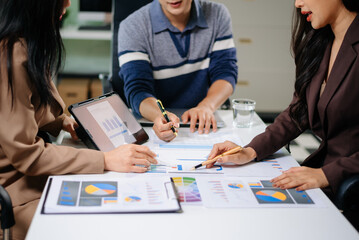 Business documents on office table with smart phone and calculator digital tablet and graph...