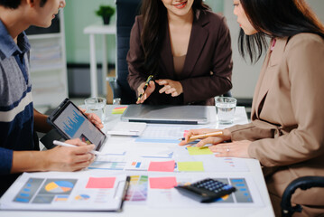 Business documents on office table with smart phone and calculator digital tablet and graph...