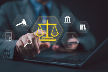 Legal Professional with Justice Icons. A suited legal professional touches virtual icons symbolizing law, justice, and legal services. Business legislation, Notary public, legal advice online, Lawyer