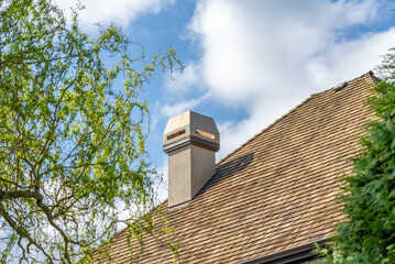 Top of luxury house with shingle roof and nice windows in Summer in Vancouver, Canada, North America. Day time on July 2025.