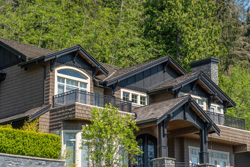 Top of luxury house with shingle roof and nice windows in Summer in Vancouver, Canada, North America. Day time on July 2025.