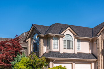 Top of luxury house with shingle roof and nice windows in Summer in Vancouver, Canada, North...