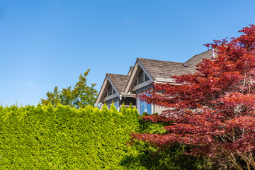 Top of luxury house with shingle roof and nice windows in Summer in Vancouver, Canada, North...