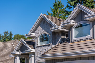 Top of luxury house with shingle roof and nice windows in Summer in Vancouver, Canada, North America. Day time on July 2025.