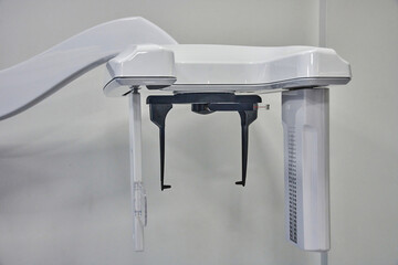 Panoramic dental X-ray machine orthopantomograph in a modern dental clinic, showcasing advanced...