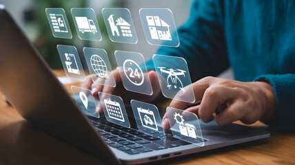 Modern businessperson uses laptop with digital logistics icons for efficiency