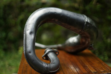 Old rusty vintage 2-stroke motorcycle exhaust