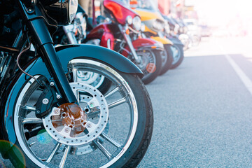 Obraz premium Motorcycle Lineup on Road at Biker Rally, Row of Parked Motorcycles