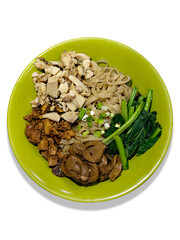 A bowl of chicken noodles served with pieces of free-range chicken, soy sauce chicken, soy sauce mushrooms and vegetable on white background.