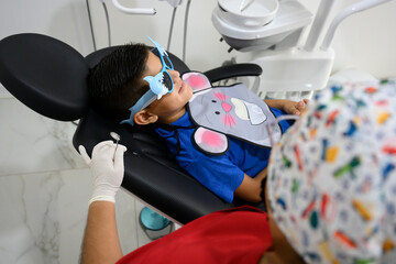 Young boy having dental checkup at the dentist's office