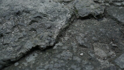 The house wall uses red brick, the background of the house wall is red brick, taken from a close distance, the cement has started to deteriorate and peel off