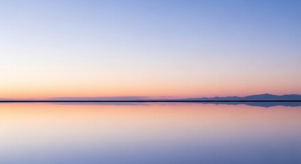 Obraz premium Serene sunset reflection over water creating a symmetrical horizon landscape