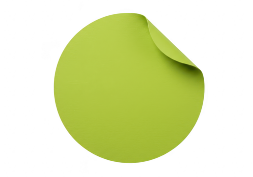 A single round lime green sticker with a slightly peeled corner is isolated on a clean transparent background - Powered by Adobe