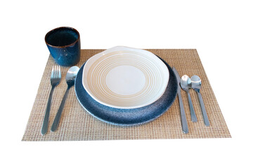 Set of Ceramic plates, cups, coffee cups and spoons and forks silver cutlery isolated on cut out PNG or transparent background. Modern kitchenware for decorating the dining table.