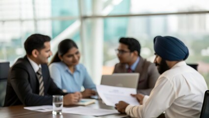 Strategic Planning Session Among Indian Executives with Blurred Office Setting
