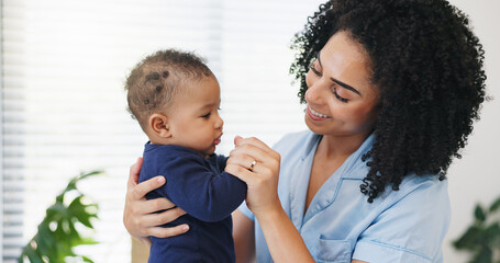 Mother, happy and playing with baby in home for bonding together, security and connection. Love,...
