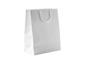 Plain white paper gift bag with white handles isolated on a transparent background