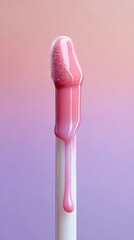 Close up of a cosmetic applicator with pink lip gloss dripping down the wand against a gradient background of pink and purple.