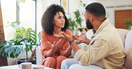 Frustrated couple, argument or fight with disagreement on sofa for conflict or living room dispute....