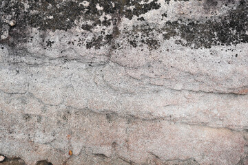 Natural stone wall with wavy Cross-Bedding texture and black stains spot