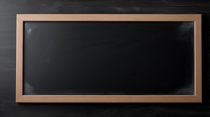 Blank blackboard in wooden frame on dark surface