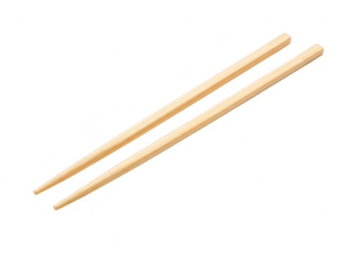 A pair of light brown bamboo chopsticks laid diagonally on a transparent background