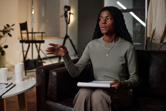 Young Adult Black Woman Gesturing While Auditioning for Acting Role Indoors