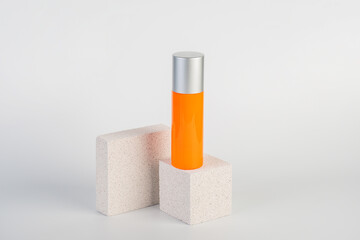 Skin care or sunscreen cosmetic with stylish props on white background.