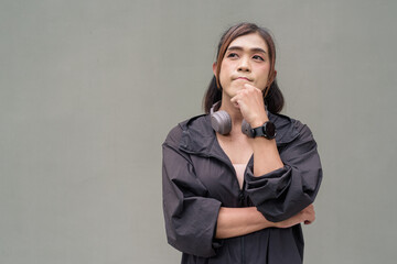 Portrait of a non binary transgender Asian woman thinking