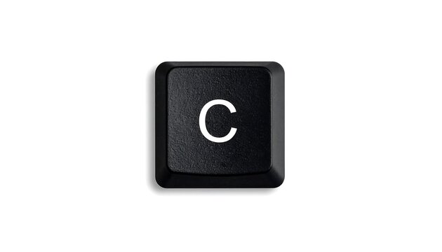 High-angle close-up of a black computer keyboard key