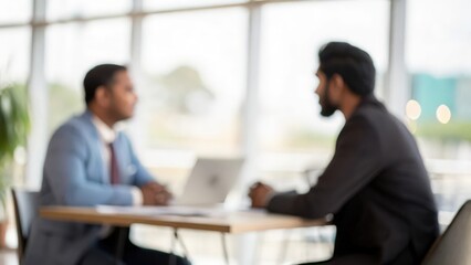 Out-of-Focus Interview Scene Between Indian Recruiter and Applicant
