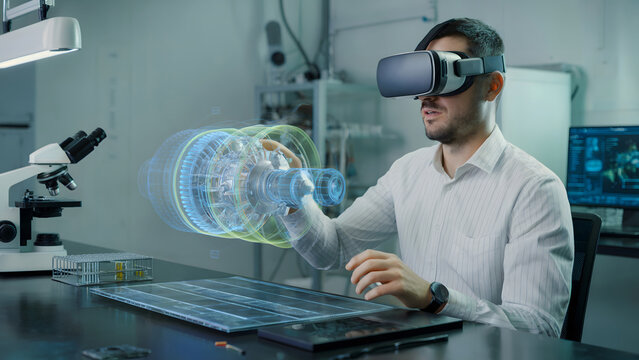 Man uses VR headset to interact with 3D engine hologram