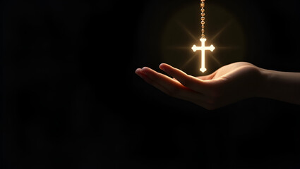 hand with Christian cross necklace on black dark copy space background blessing and hope concept