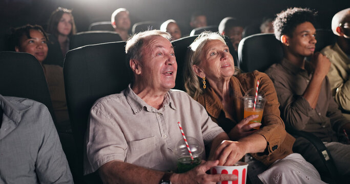 Movie, theatre and senior couple with popcorn in cinema for entertainment, experience and watching film. Retirement, marriage and elderly man and woman with snacks for screening, premiere and film