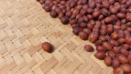 the process of drying coffee beans using traditional methods with sunlight to reduce the moisture...