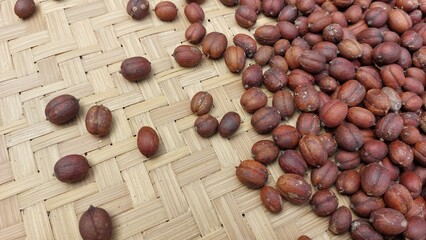 the process of drying coffee beans using traditional methods with sunlight to reduce the moisture...