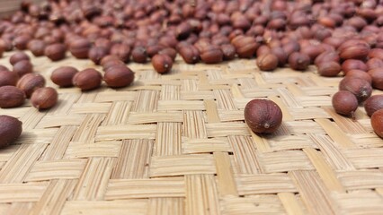 the process of drying coffee beans using traditional methods with sunlight to reduce the moisture...