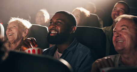 Watching, film and man with popcorn, movie theater and smile for premiere, weekend or...