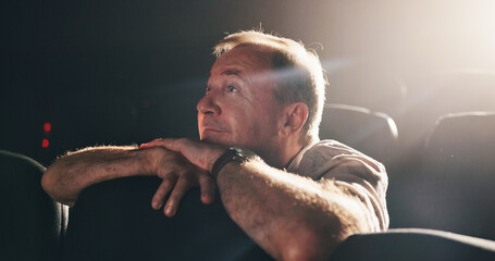 Cinema, thinking and watching movie with senior man, memory and nostalgia with lights. Pensioner,...