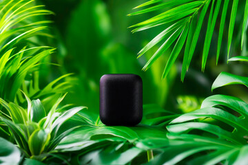 Black matte wireless speaker with greenery tech