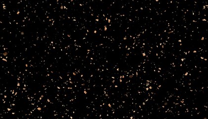 Abstract digital image of scattered brown particles on black background
